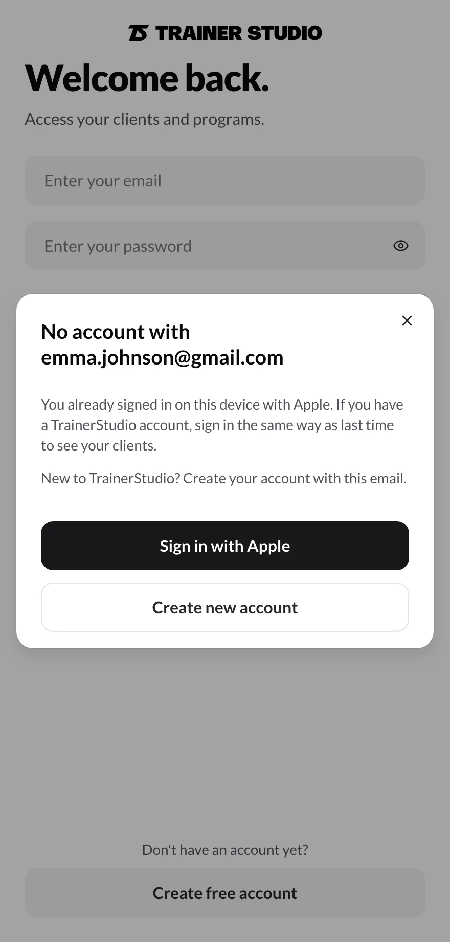 “No account with emma.johnson@gmail.com” dialog explaining that you already signed in on this device with Apple, with the “Sign in with Apple” and “Create new account” buttons